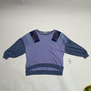 NWT FREE PEOPLE WE THE FREE oversized purple top in “cornflower combo”